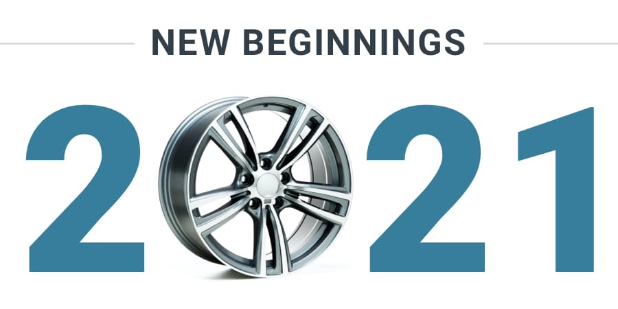 The numbers 2021 with the zero represented by a rim of a car. At the top, the words, new beginings.