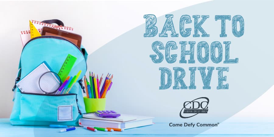 A backpack full of school supplies. To the right, the words: Back to school drive.