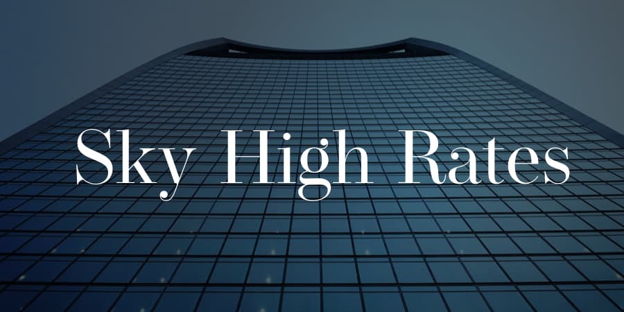 An upward view of a skyscraper. At the center, the words: sky high rates.