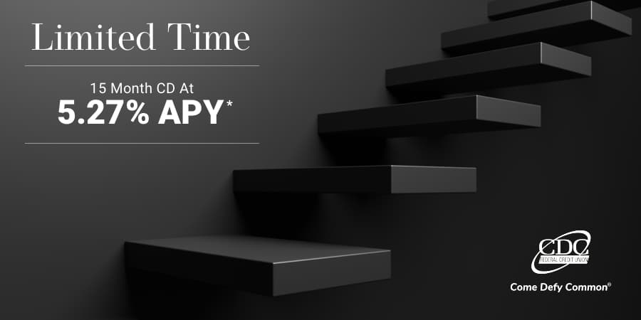 Modern, dark floating staircase. At the top left, the words: limited time 15 month cd at 5.27% APY*