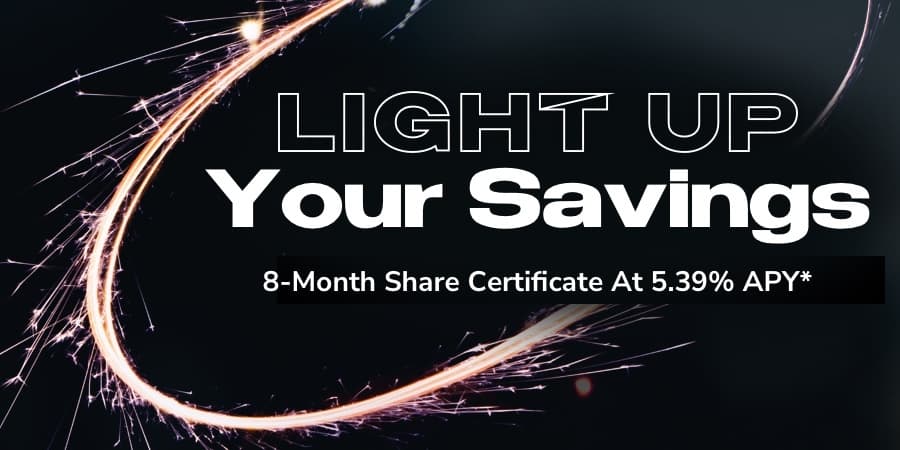 Sparkler forming an oval against a dark background. At the right, the words: light up your savings 8-month share certificate at 5.39% APY*