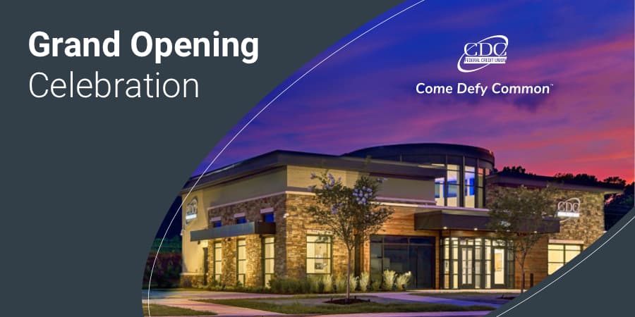 A curbside view of the new branch at night. At the top left, the words: grand opening celebration.