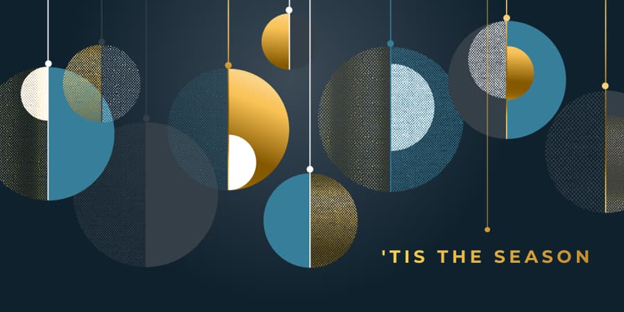 An illustration of multi-colored holiday ornaments. At the bottom right, the words: 'tis the season.