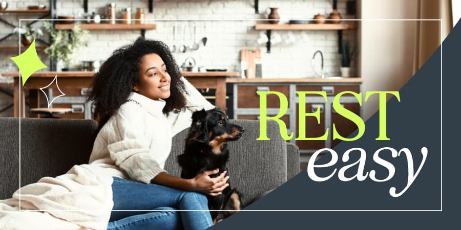 A young woman resting on a couch with her dog. At the bottom right, the words: rest easy.