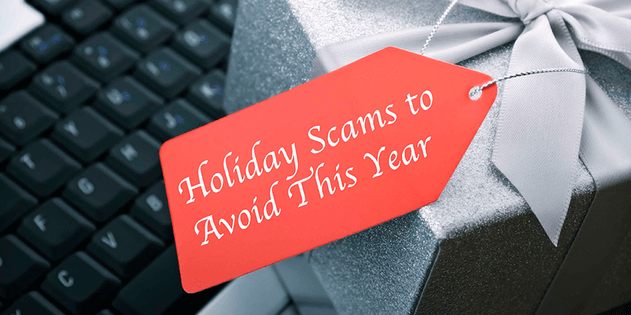 A gift box resting on a keyboard with a tag that reads: holiday scams to avoid this year.