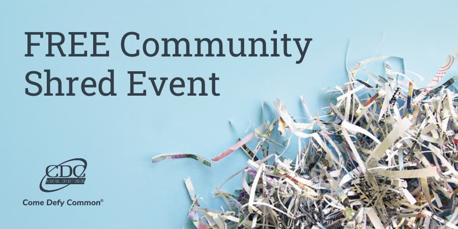 A large bin containing shredded paper. At the top left, the words: free community shred event.