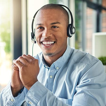 A call center representative wearing a headset microphone.