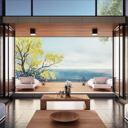 A living room view of a modern home overlooking the beautiful ocean.