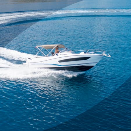 An arial view of an open fisherman boat on the ocean.