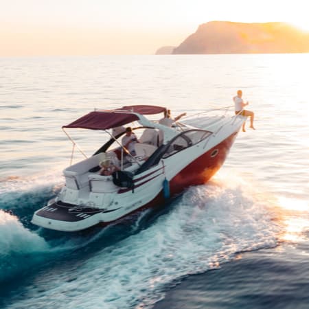 An arial view of an open fisherman boat on the ocean.