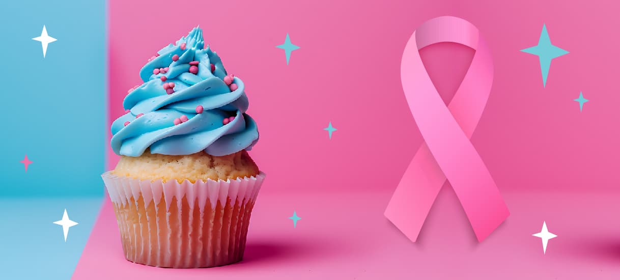 A cupcake next to the Breast Cancer Awareness ribbon.