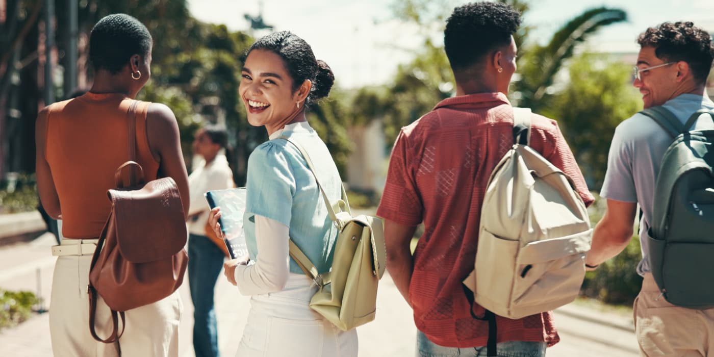 A group of students walking on campus.