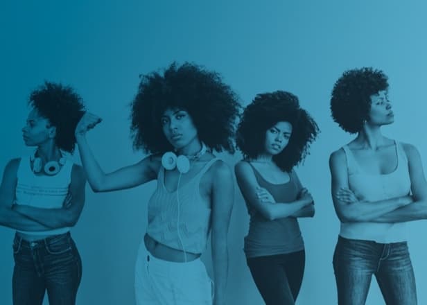 A group of woman posing with expressions of empowerment.