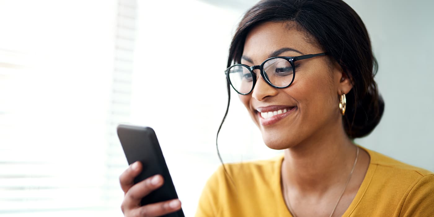A young professional woman using a smartphone.